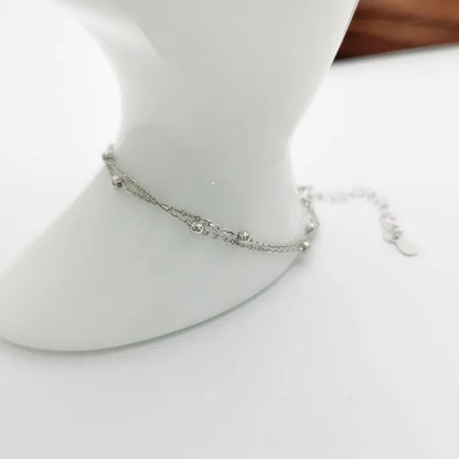 Bracelet double chaîne en doré