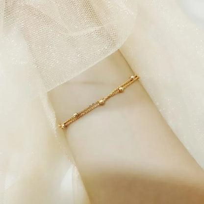 Bracelet double chaîne en doré