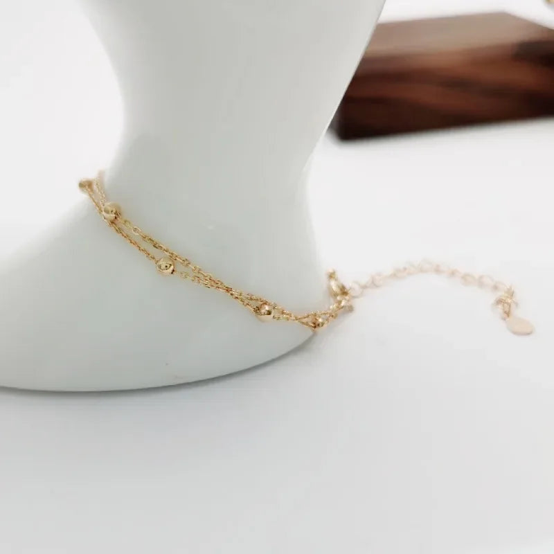 Bracelet double chaîne en doré