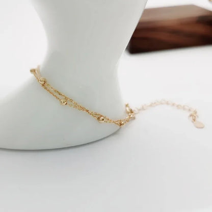 Bracelet double chaîne en doré