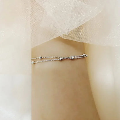 Bracelet double chaîne en doré