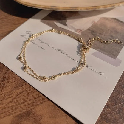Bracelet double chaîne en doré
