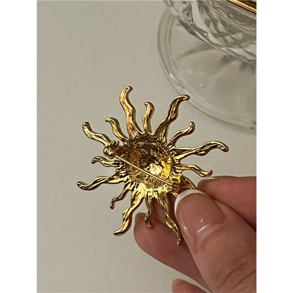 Broche soleil