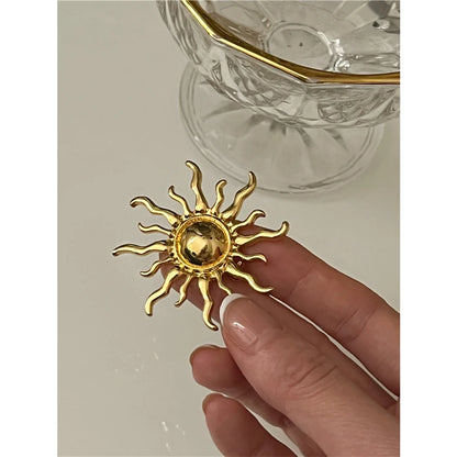 Broche soleil