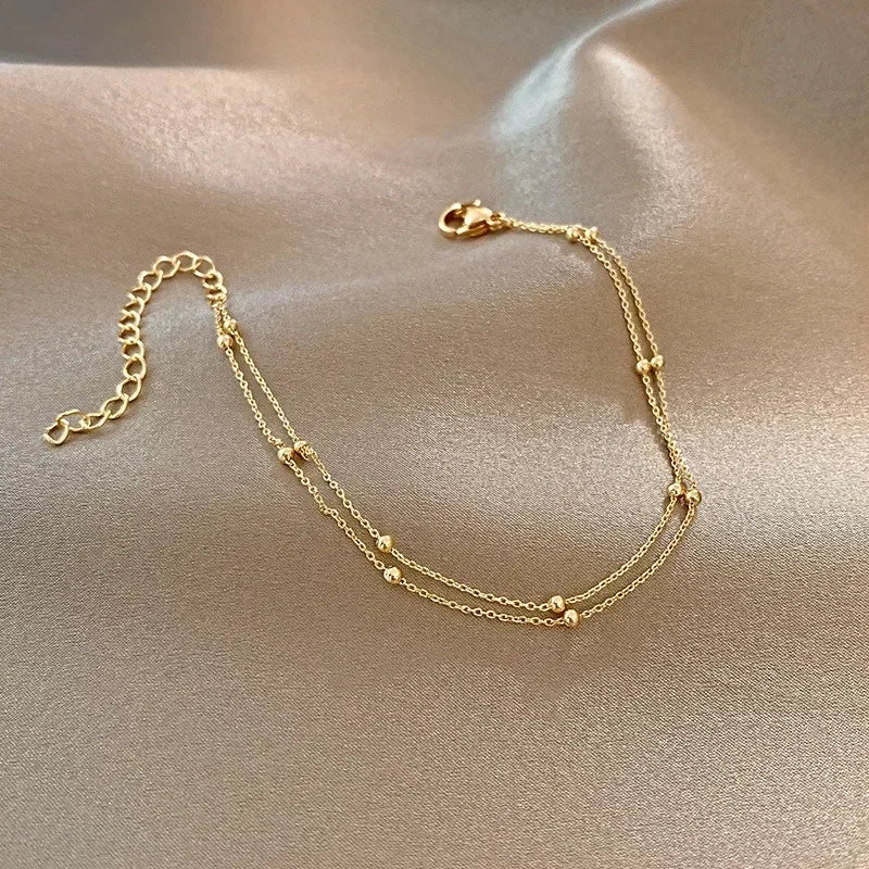 Bracelet double chaîne en doré