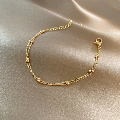 Bracelet double chaîne en doré