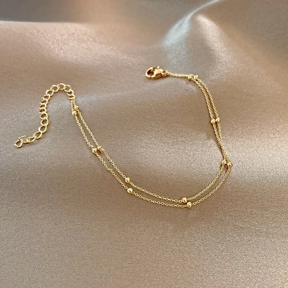 Bracelet double chaîne en doré